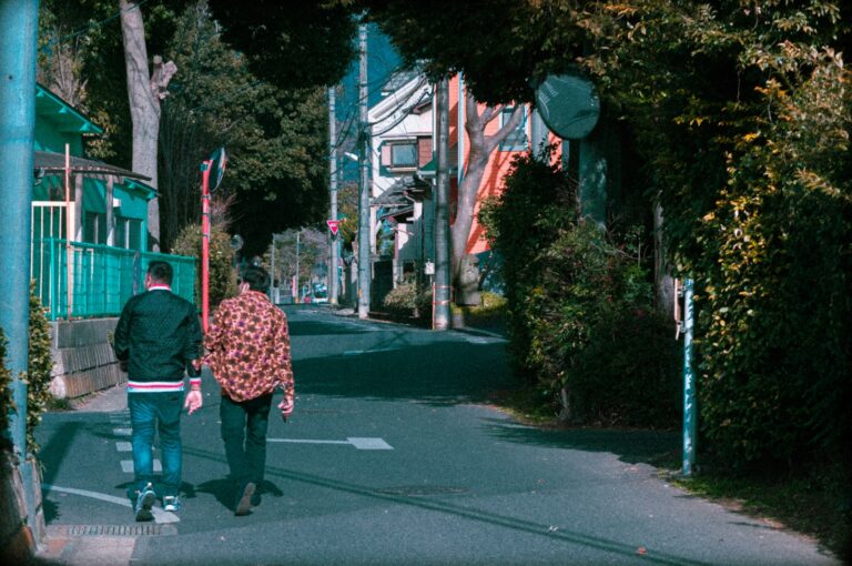 a man and a woman walking down a street